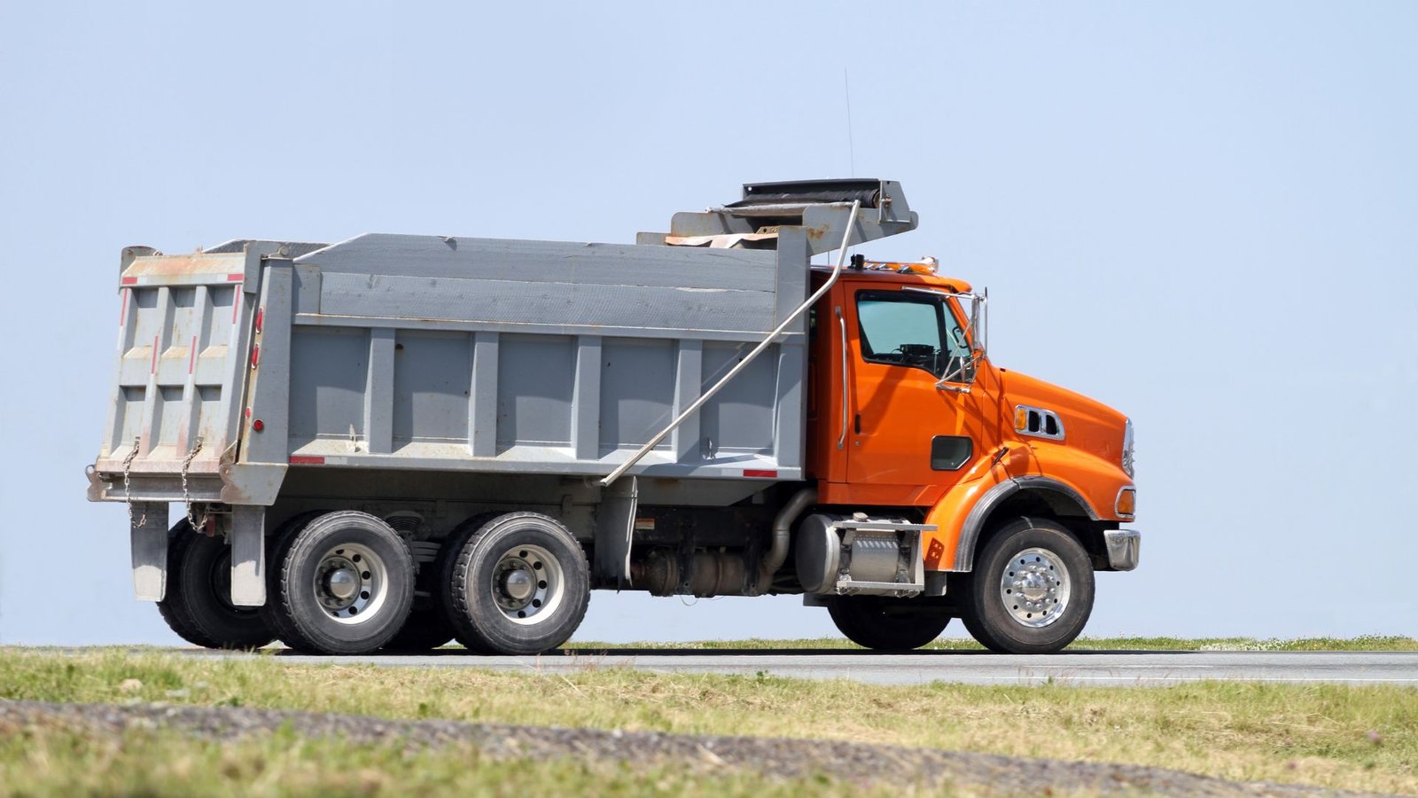 Construction utility truck with protective coating on a work site